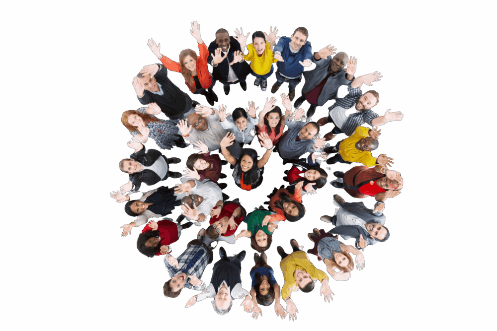 a group of people standing in a circle with their hands up